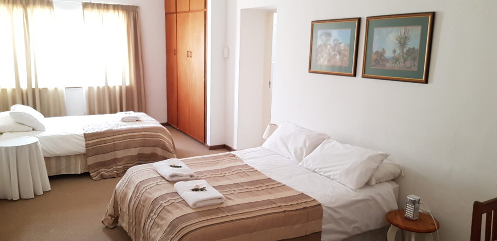 ROOM 2 HAS A DOUBLE BED AND A SINGLE BED, AND SHARES A BATHROOM WITH ROOM 1. PRIVATE USE OF THE BATHROOM IS AVAILABLE AT AN EXTRA R50 PER NIGHT.